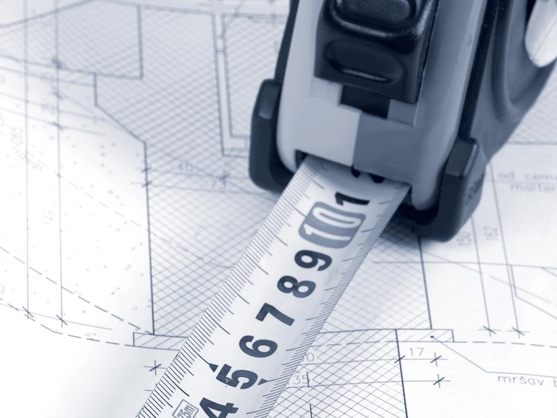 Tape measure on blueprints - Free in-home estimates from Carpet Villa in Grand Rapids, MI